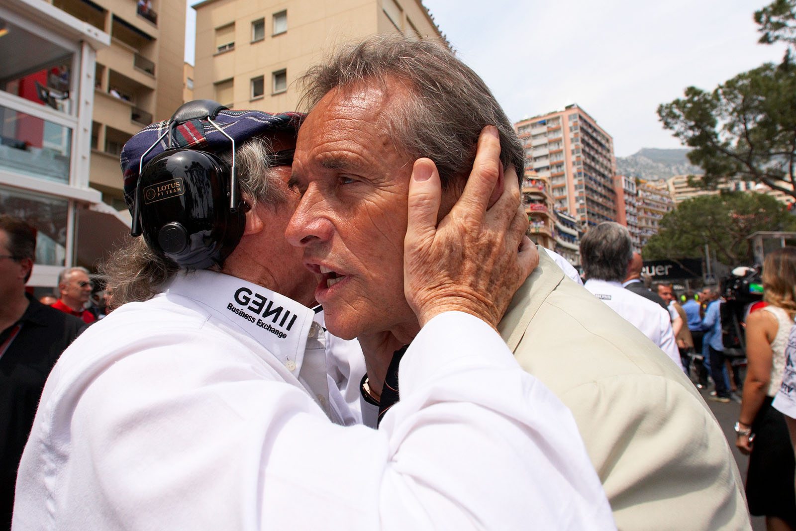 Sir Jackie Stewart whispers into Jacky Ickx' ears