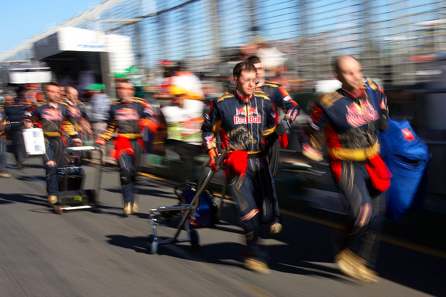 Red Bull mechanics rush to grid before the race