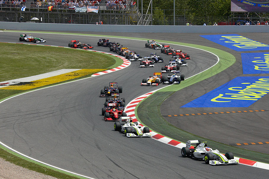 Rubens Barrichello leads the start field through first chicane