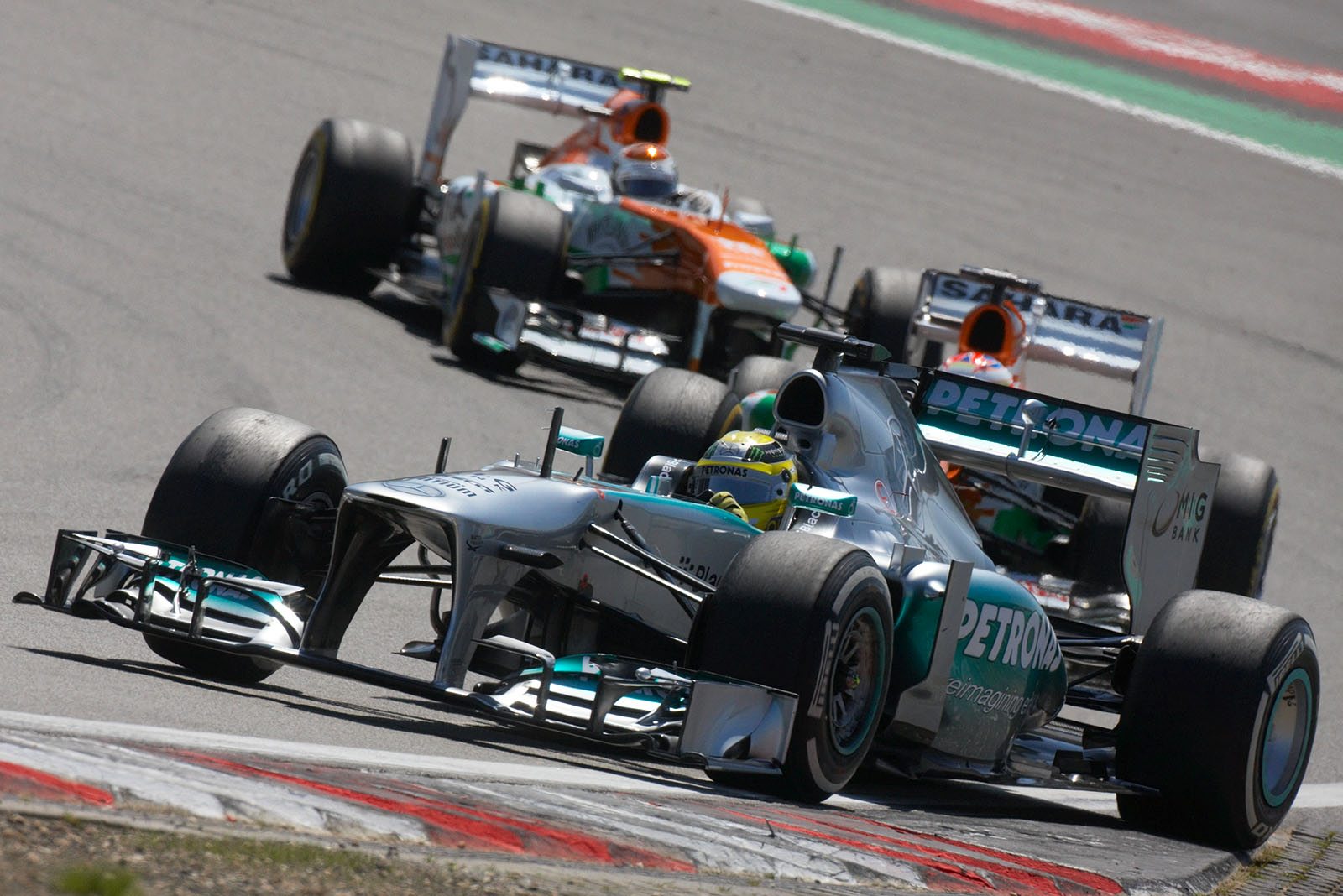 Nico Rosberg, Mercedes GP, in front of the two Force India racers