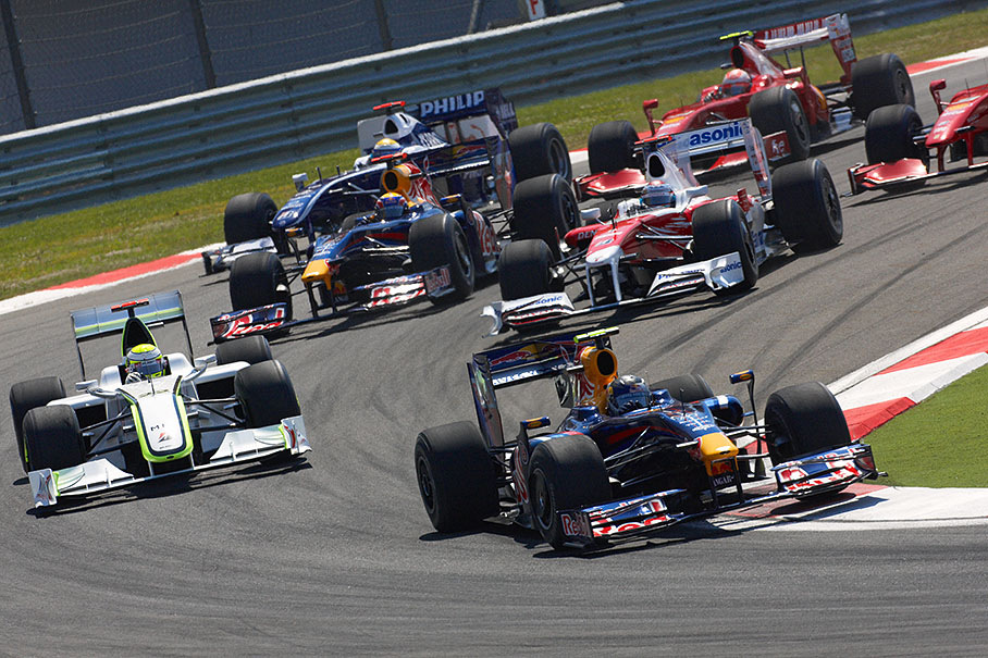 Red Bull's Sebastian Vettel leads Button and the other chasers into first corner