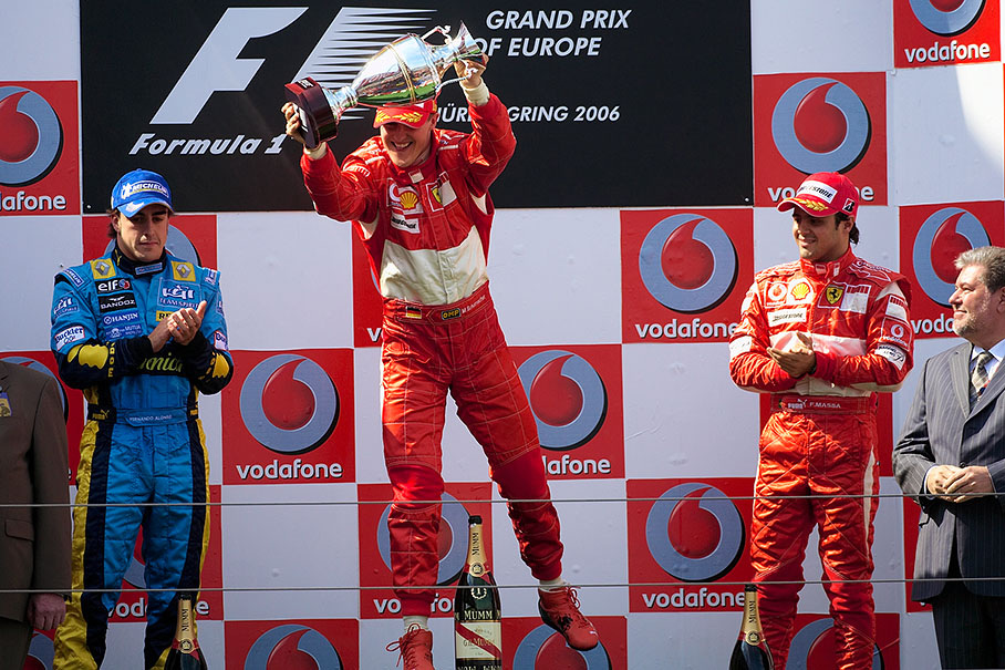Michael Schumacher being cheered by his prosecutor, teammate and minister president Kurt Beck