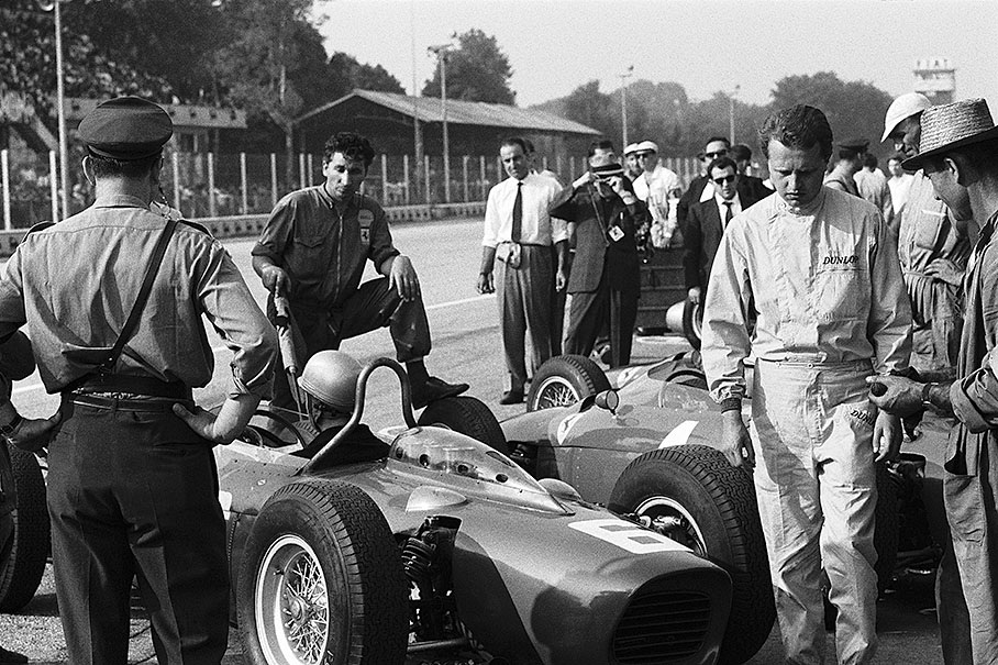 Ferrari line up in the pits with driver Giancarlo Baghetti at the right