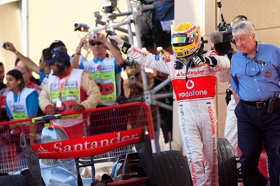 Lewis Hamilton cheers to his team from parc fermé