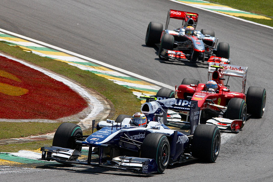 A fast Hulkenberg is chased by pushing Alonso and Hamilton