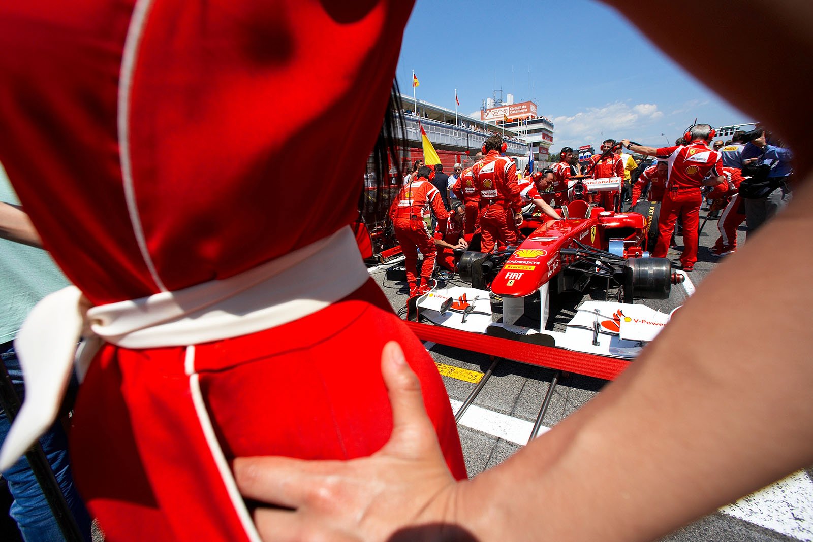 Alonso's Ferrari ready on the grid.
