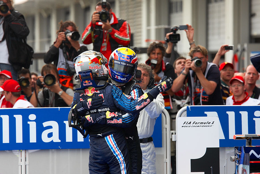 1-2 winning Red Bull team mates Webber and Vettel hug each other in parc ferme