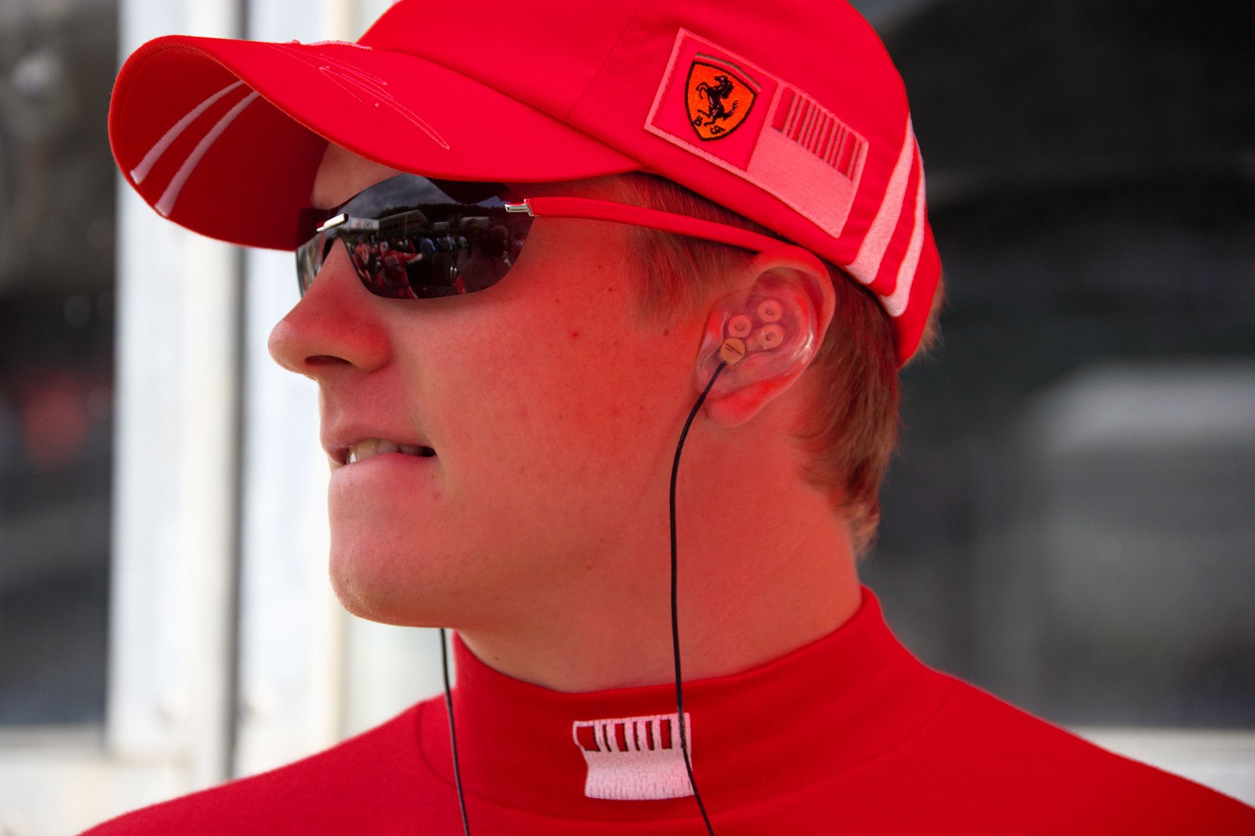 On the grid: Kimi Raikkonen with earphones