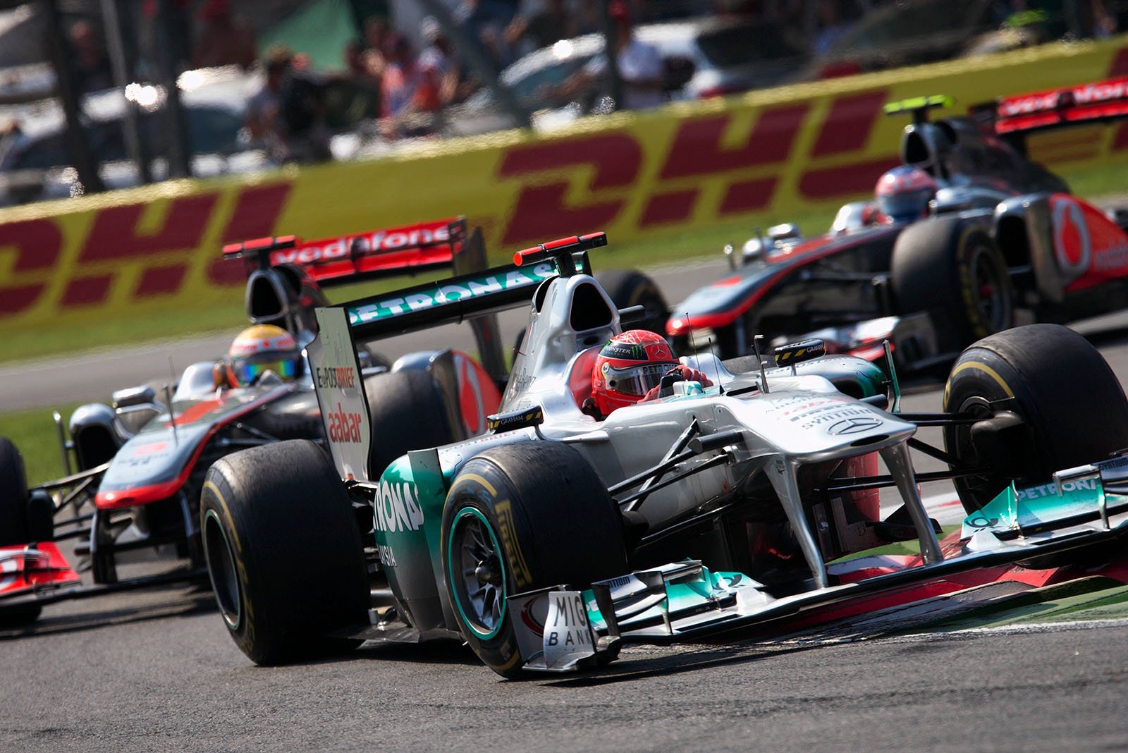 Michael Schumacher, Mercedes GP, sticks in front of the two McLarens