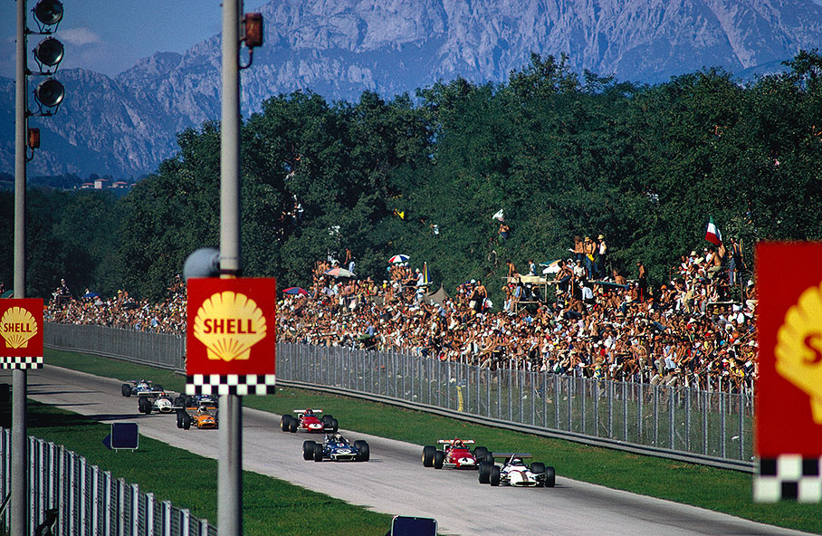 During the early laps Pedro Rodriguez' BRM leads Clay Regazzoni's Ferrari and Jackie Stewart' March while they approach towards the Parabolica