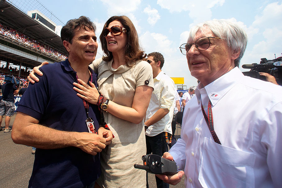 Triple World Champion Nelson Piquet on the grid with Slavica and Bernie Ecclestone