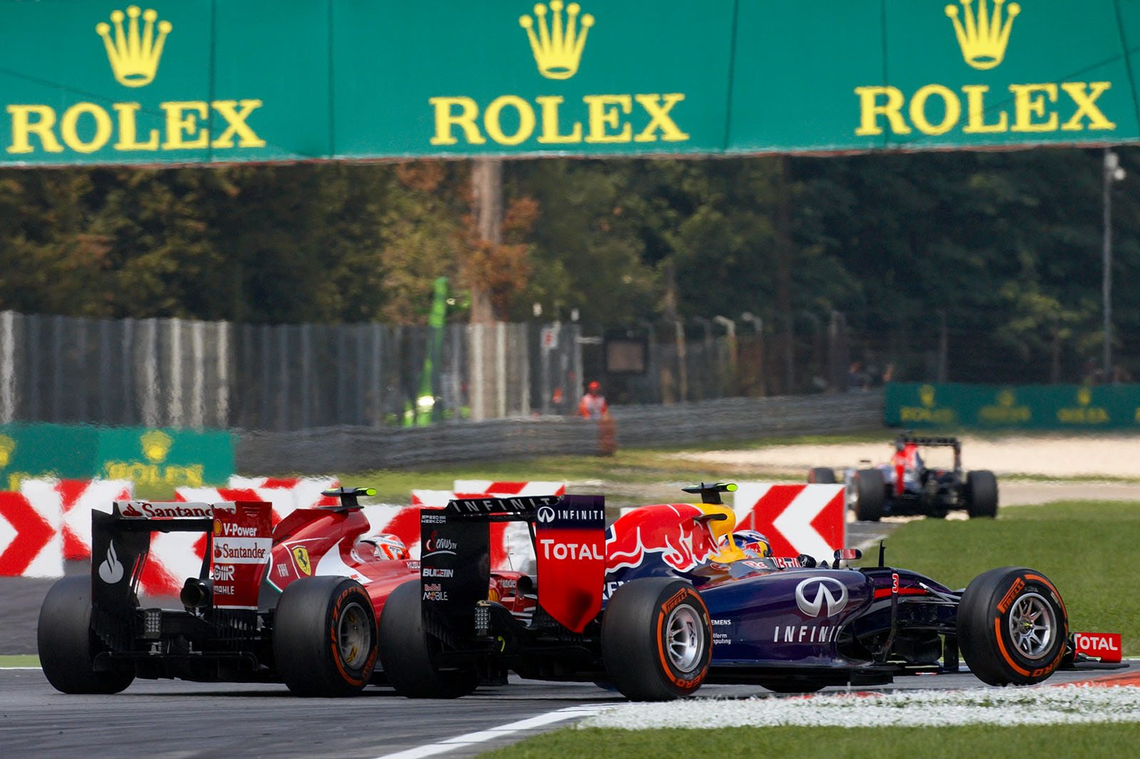 Daniel Ricciardo, Red Bull-Renault, passes Kimi Raikkonen's Ferrari, Italian Grand Prix, Monza, 2014