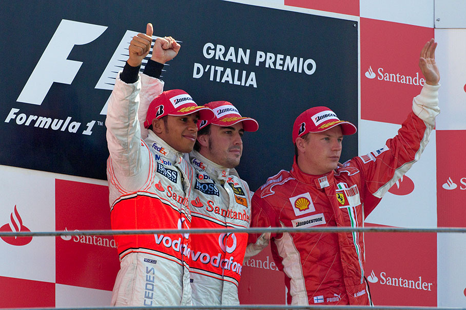 Podium group photo of second placed Hamilton, winner Alonso and third Raikkonen