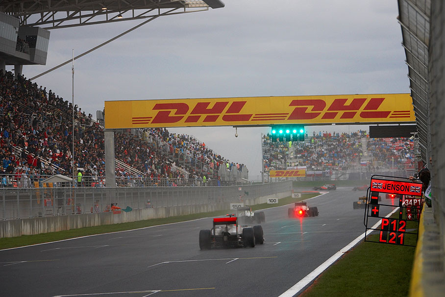 The wet race field passes the pit wall signals