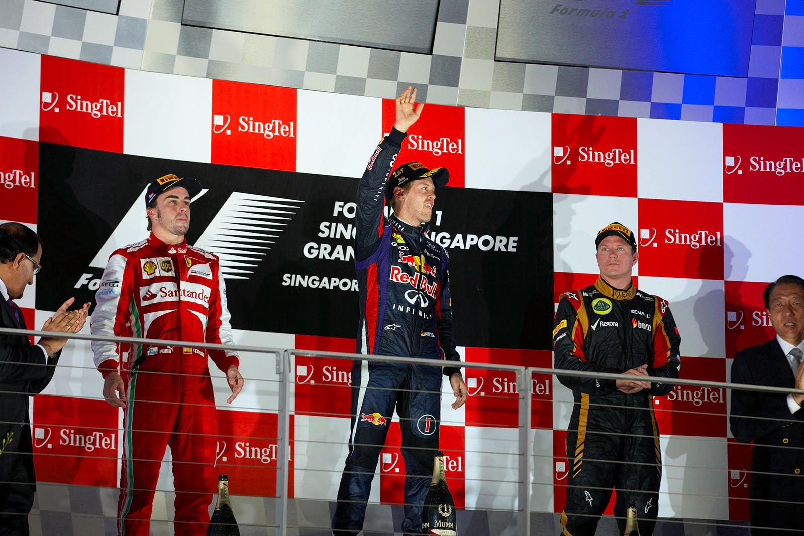 On the podium are Fernando Alonso (2nd), winner Sebastian Vettel and Kimi Raikkonen (3rd)