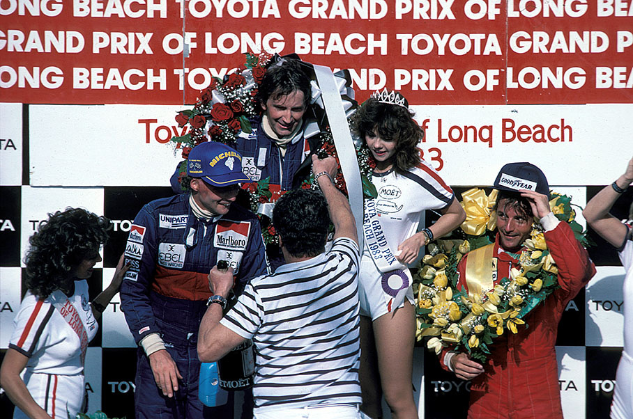 Winner John Watson on the podium, flanked by McLaren team mate Niki Lauda and third placed René Arnoux