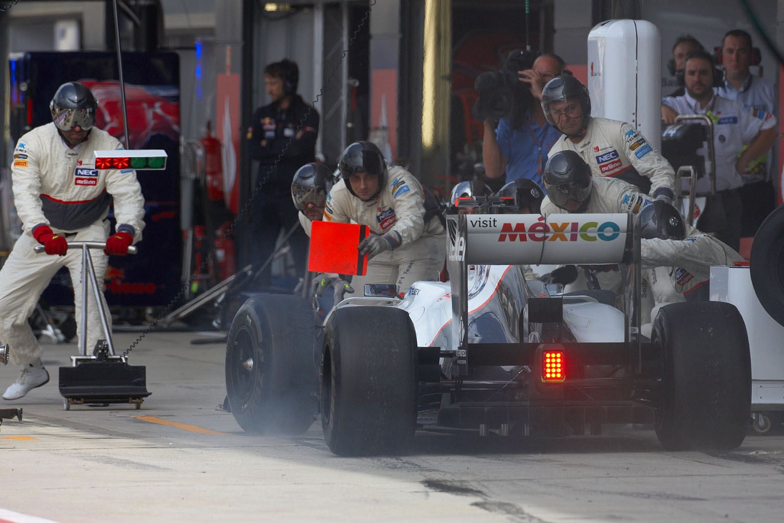 Kamui Kobayashi comes to Sauber pits besides the racing line