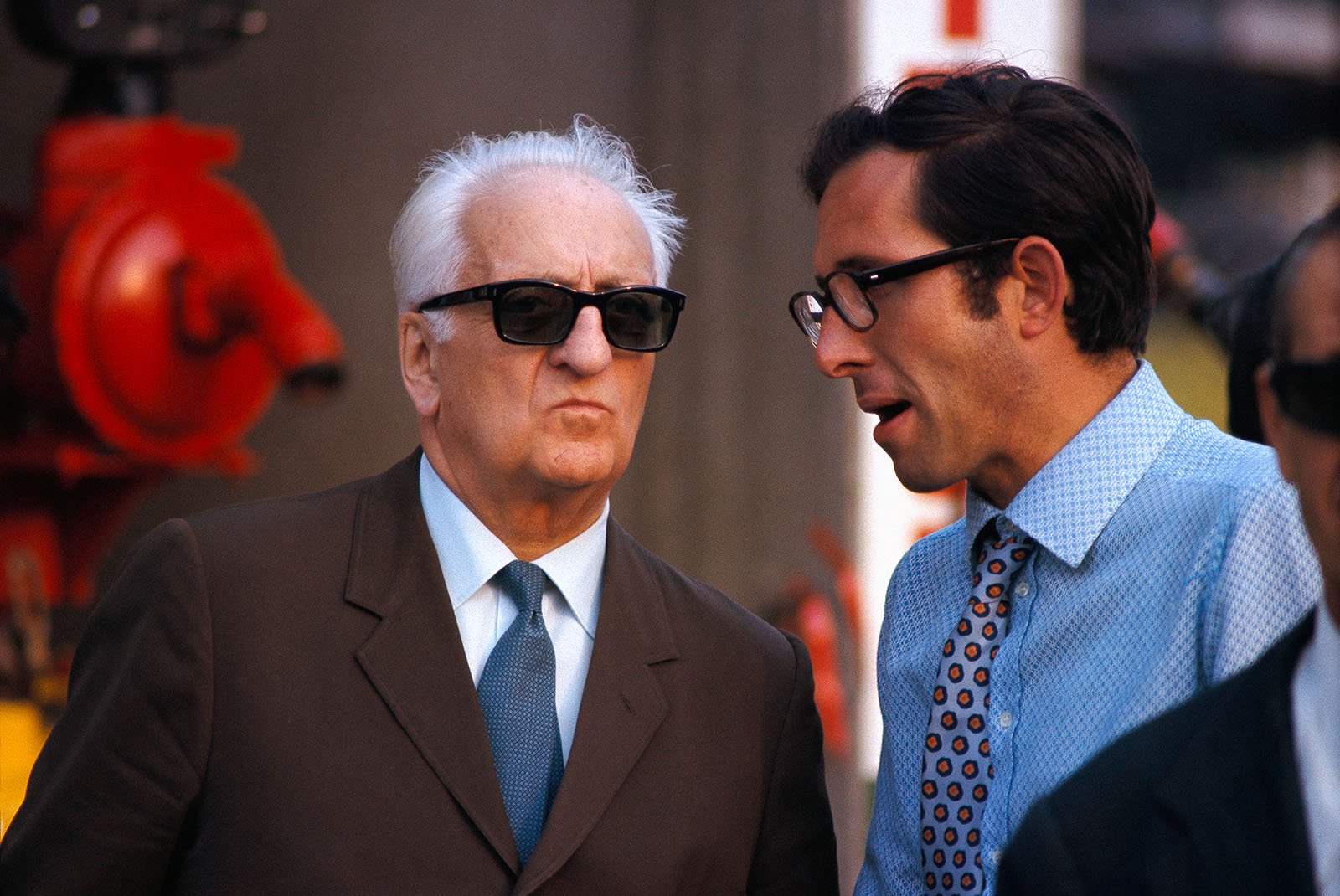 Enzo Ferrari listens to his chief engineer Mauro Forghieri