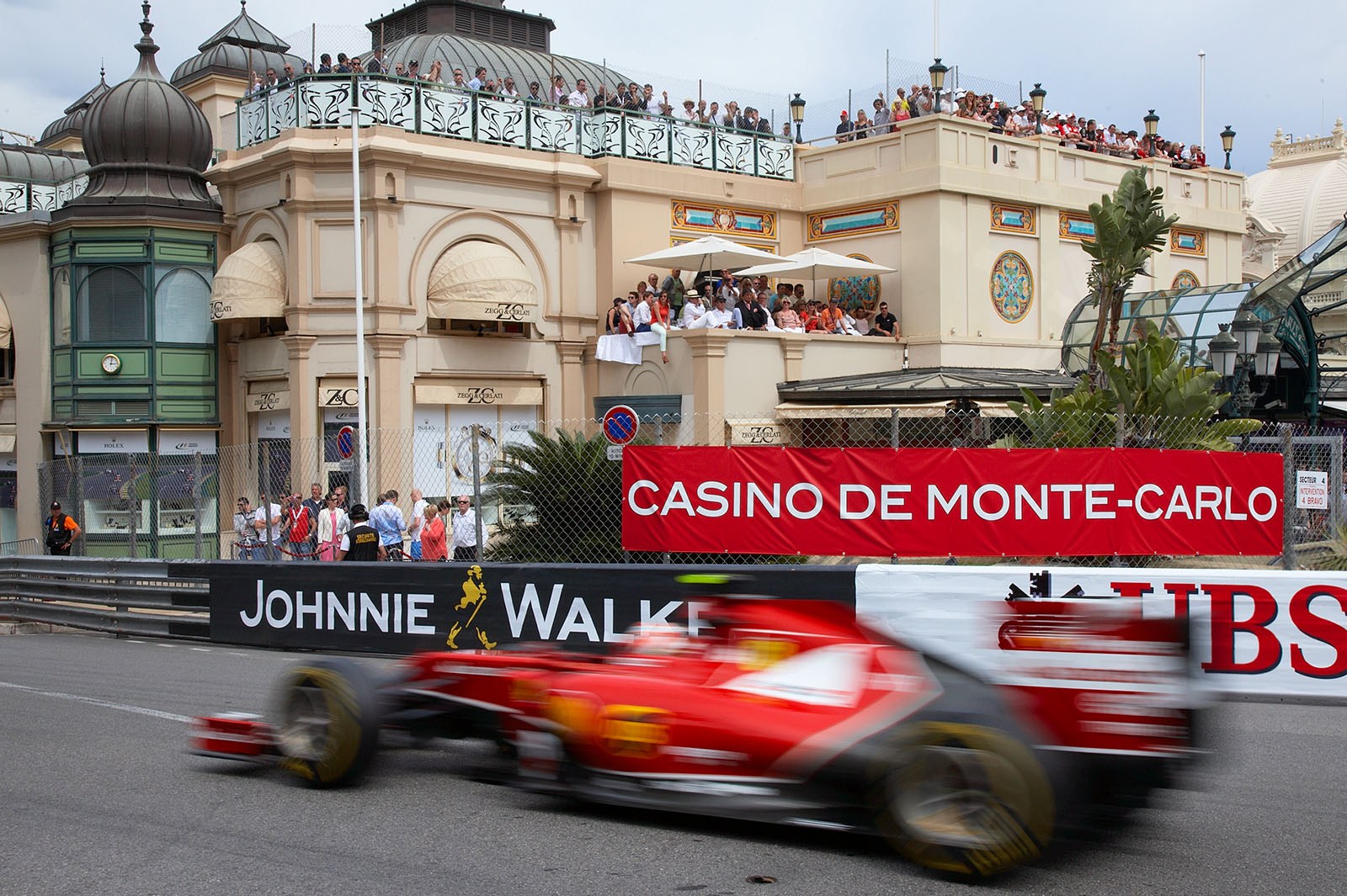 Kimi Raikkonen, Ferrari, passes the Casino, Monaco Grand Prix, 2014