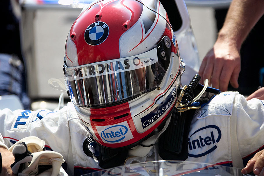 Robert Kubica taking place in his cockpit