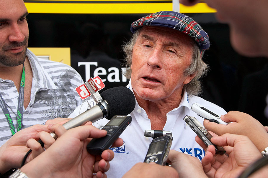 Triple F1 World Champion Jackie Stewart (1969, 1971 &amp; 1973) gives an interview in the paddock