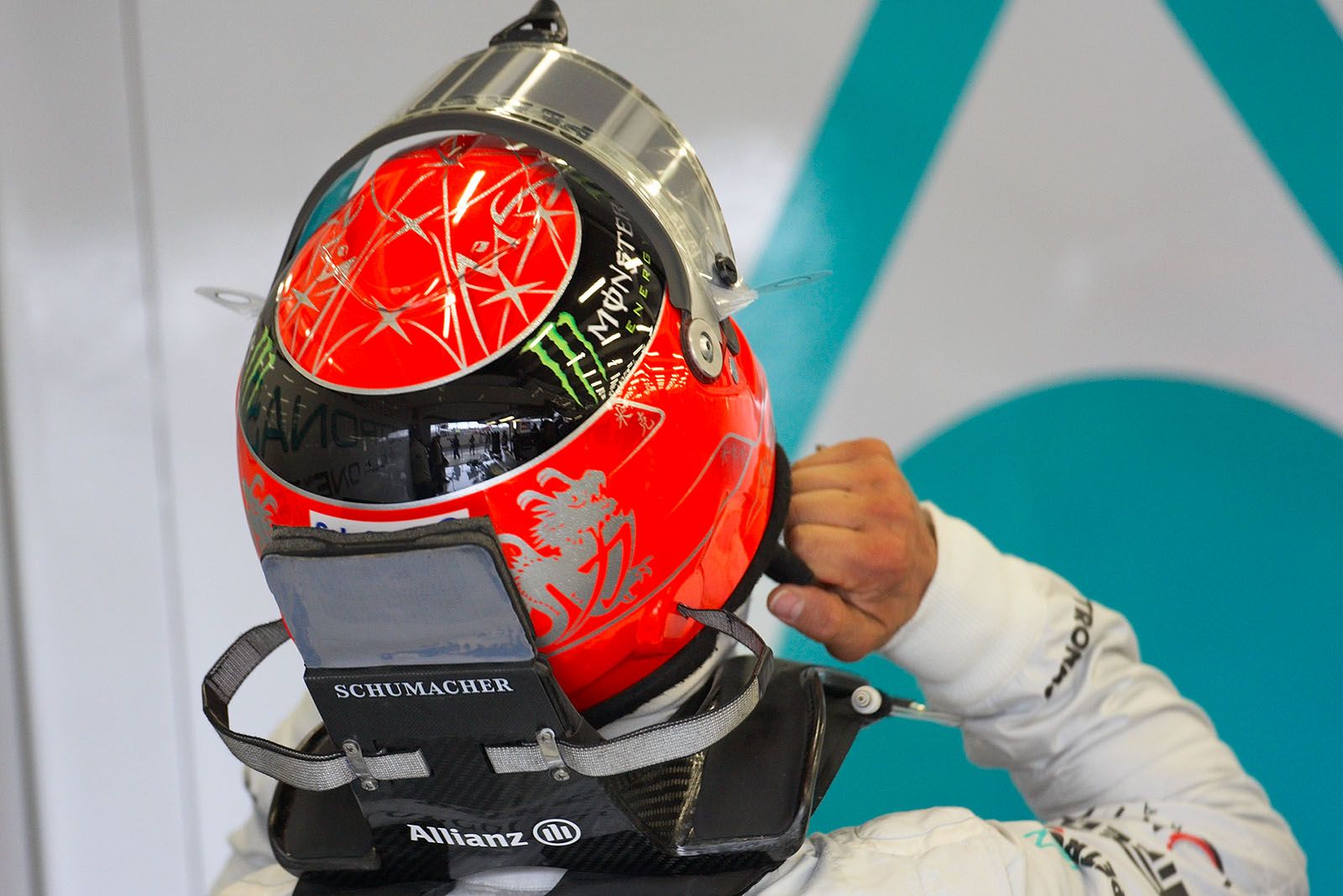 Michael Schumacher, Mercedes GP, puts his helmet on
