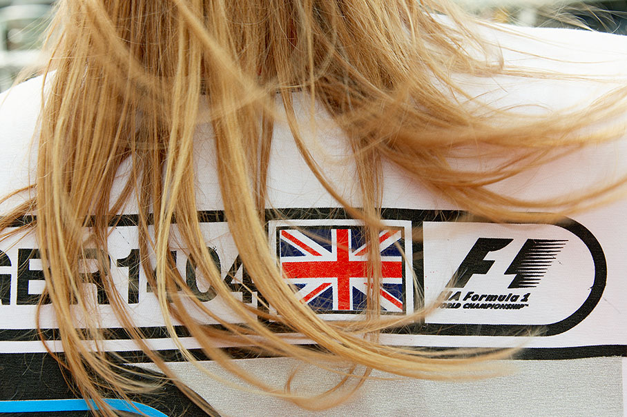 A female marshal guards the pitlane