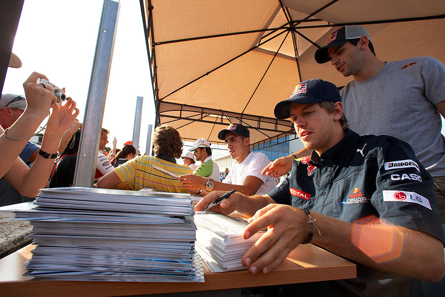Vettel, Alguersuari and Buemi during the autograph session