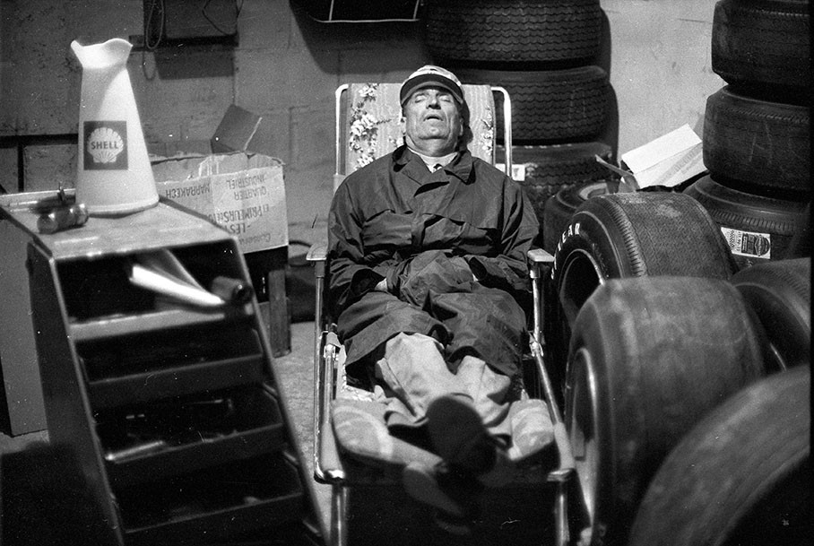 An exhausted mechanic takes a nap at night during the 24hrs Le Mans 1967