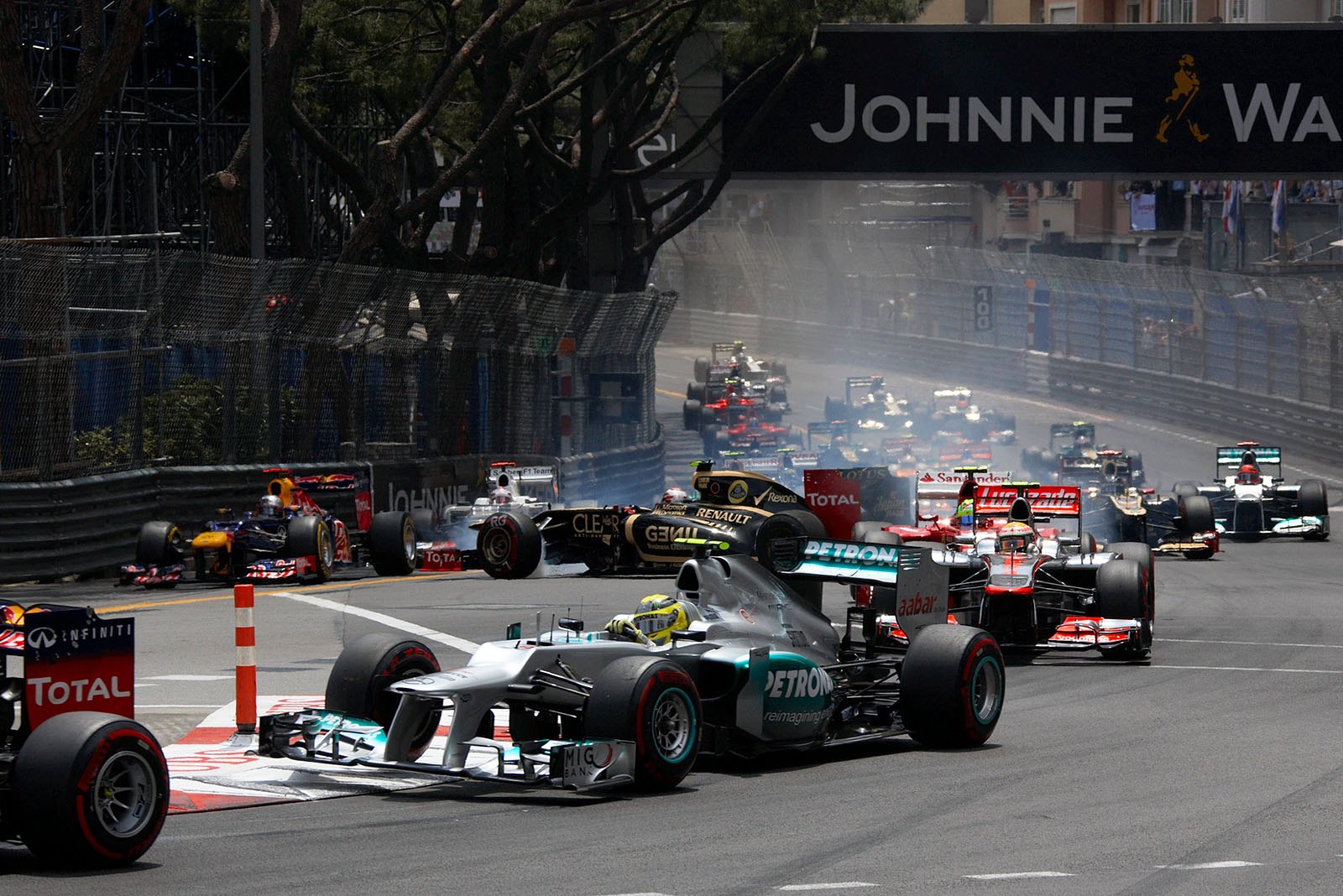 At the start, after a collision with Schumacher, Romain Grosjean's Lotus cannonballs through the field