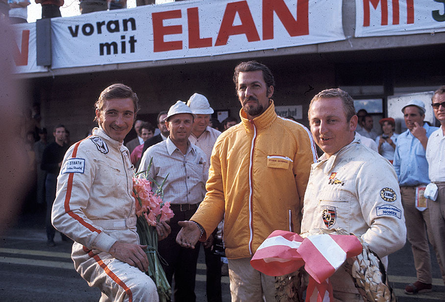 Race winners Jo Siffert and Kurt Ahrens pose for the press together with second placed Jo Bonnier