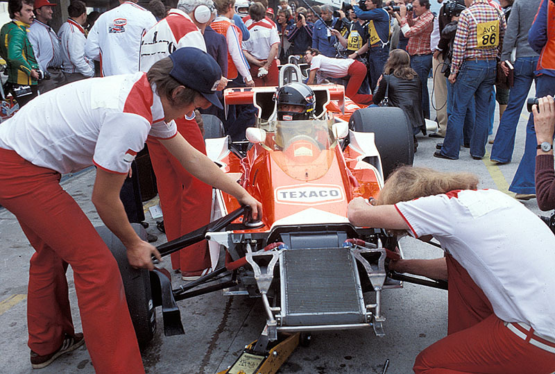 James Hunt's McLaren-Cosworth is prepared whilst the German press surrounds the local hero Jochen Mass behind him, German GP Hockenheim 1977