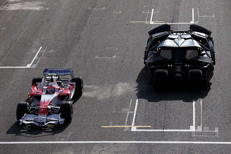 Toyota organises a promotional presentation of the Batmobile driving besides a Toyota car