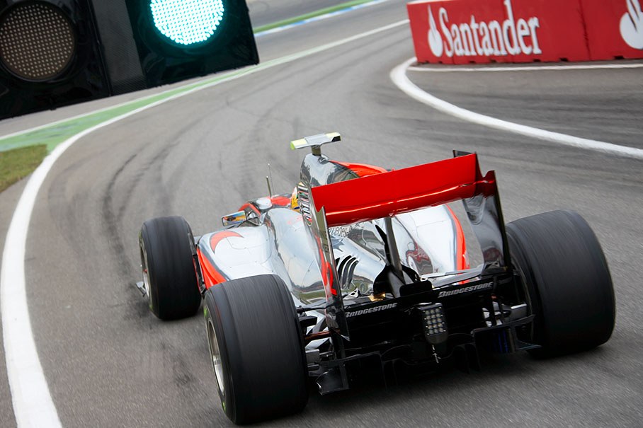 Lewis Hamilton, McLaren Mercedes, passes the green lights at pit lane xit
