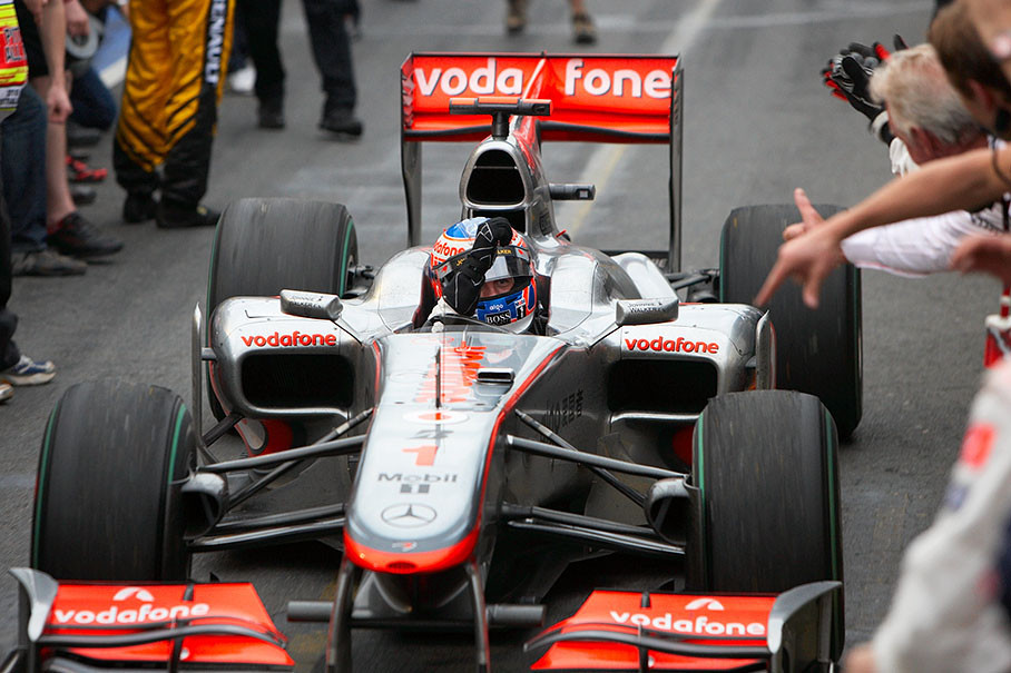Race winner Jenson Button, McLaren Mercedes, waves at his dad in the cheering crowds in pitlane