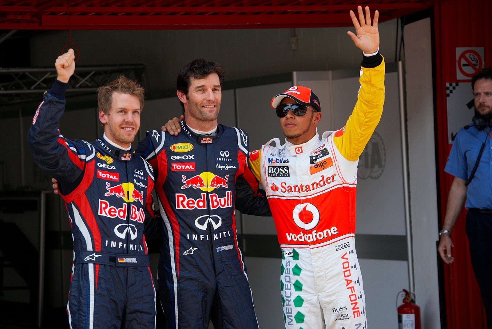 Mark Webber celebrates his Pole Position with second placed Sebastian Vettel and third Lewis Hamilton.
