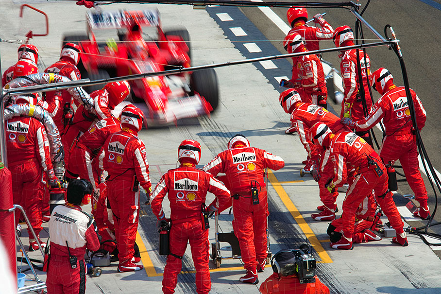 Michael Schumacher coming into the pits for refuling.