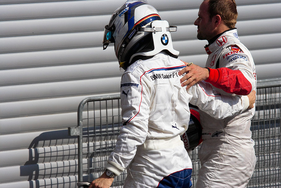 Nick Heidfeld in parc ferme with Rubens Barrichello.