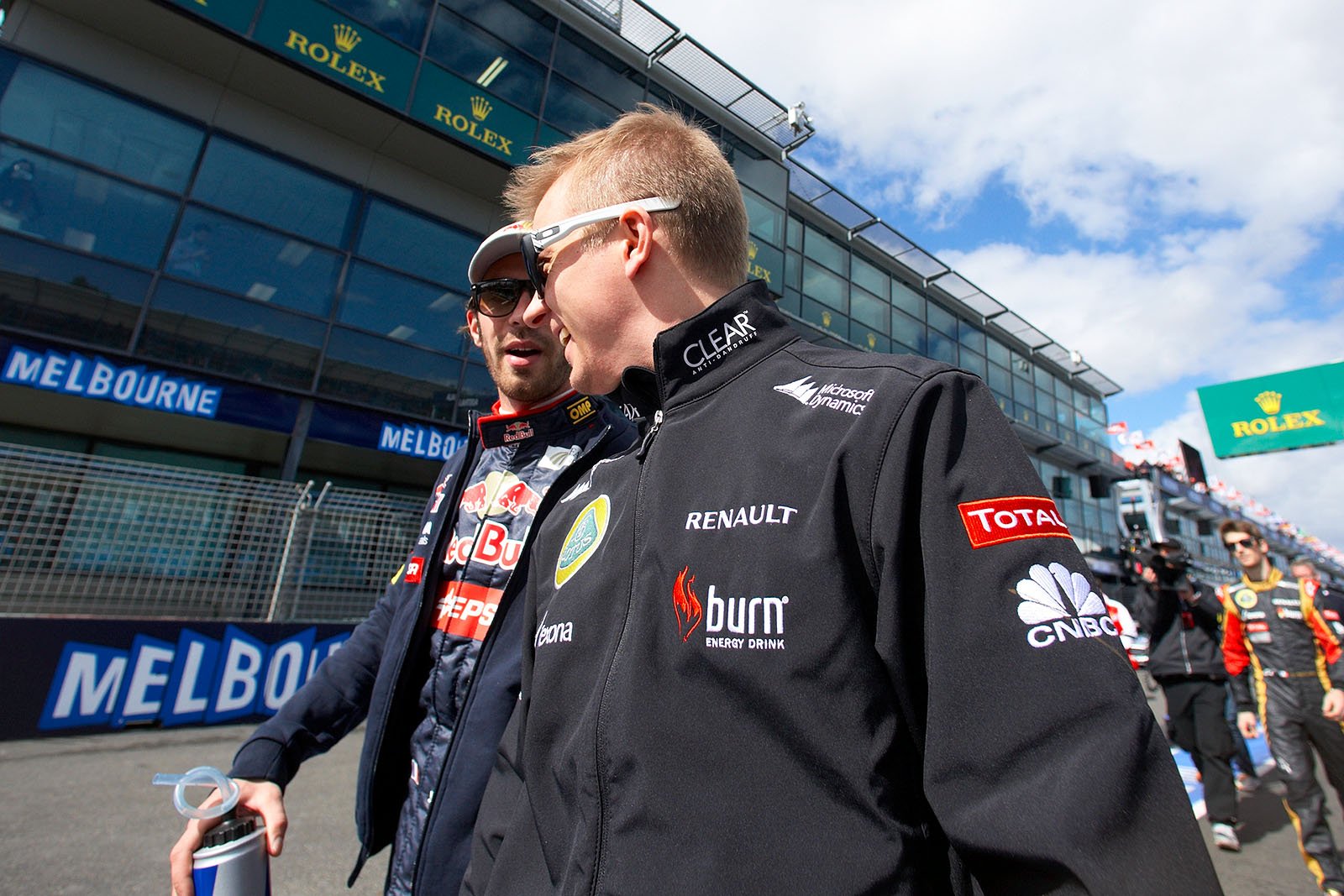 Kimi Raikkonen of Lotus and Jean-Eric Vergne of Toro Rosso walk to the drivers parade