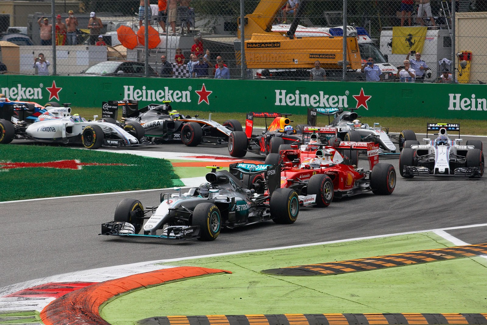 Nico Rosberg, Mercedes, leads the Italian Grand Prix at Monza, 2016, right away from the start after a slow get away by his team-mate and pole setter Hamilton