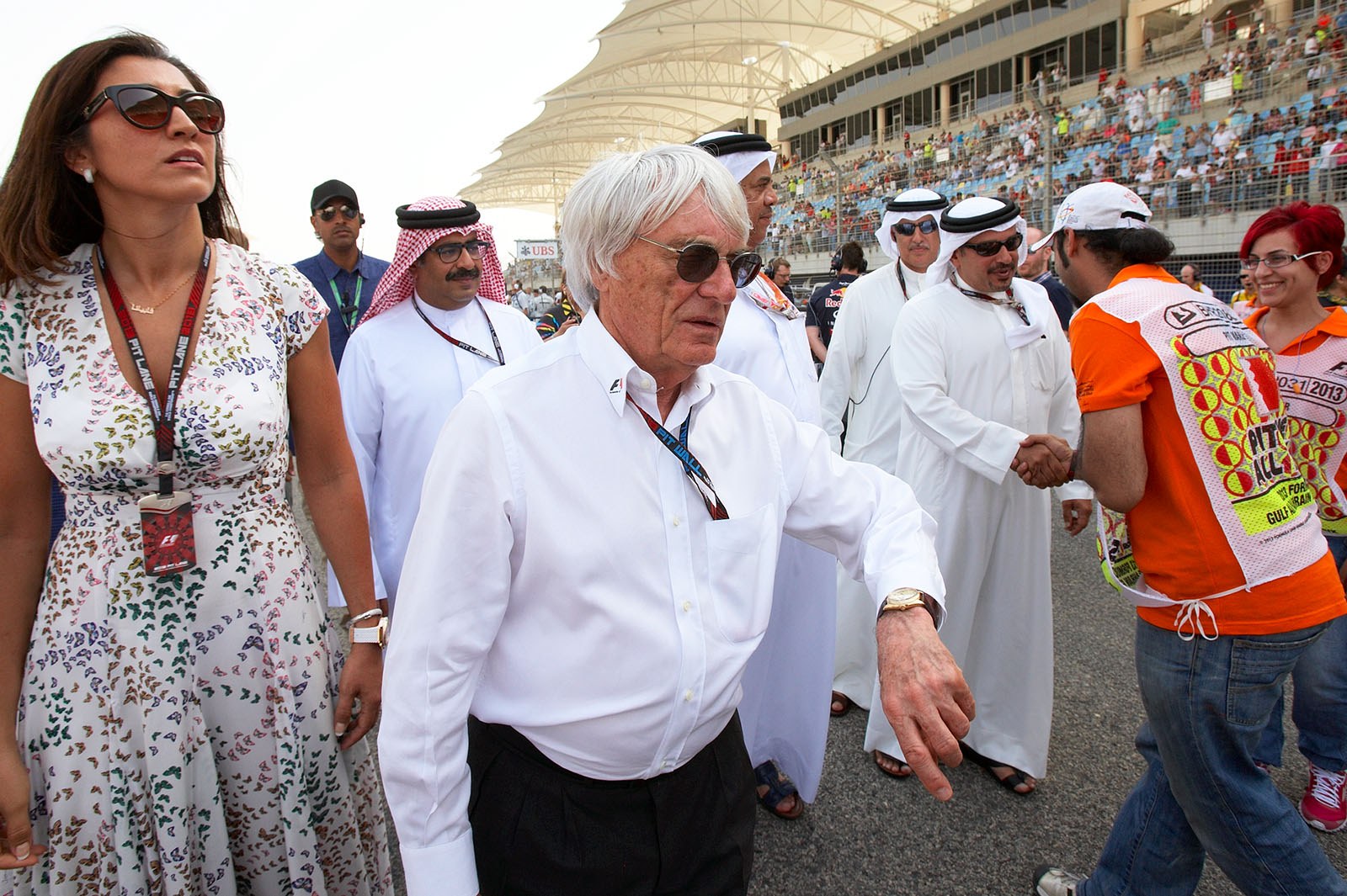 Formula One Group CEO Bernie Ecclestone walks the grid with his wife Fabiana Flosi and Crown Prince Sheikh Salman bin Isa Hamad Al Khalifa