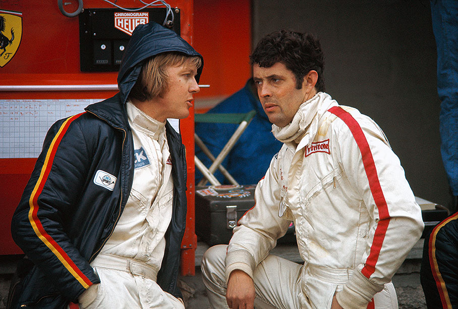 Ronnie Peterson (S) chats with Ferrari team-mate Brian Redman (GB)