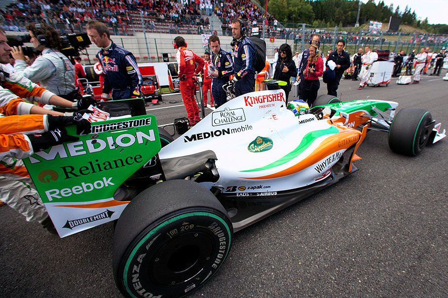 Giancarlo Fisichella in the Force India-Mercedes is being rolled over the grid to his pole position