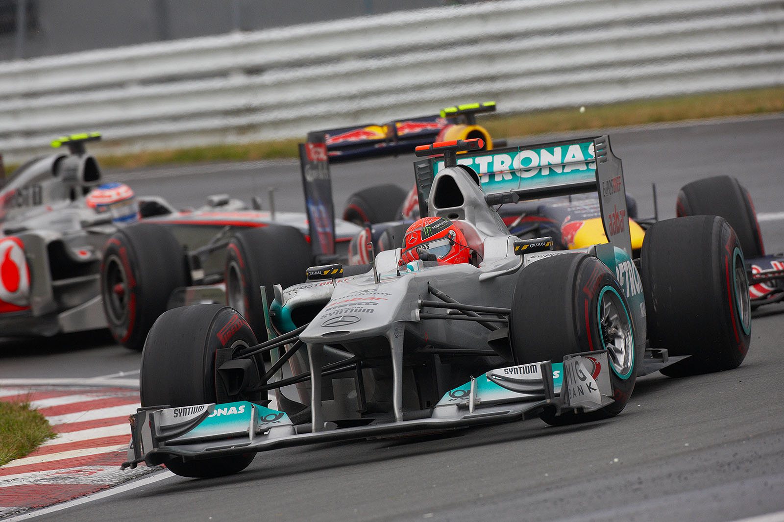 Michael Schumacher, Mercedes GP, still in front of Webber and Button