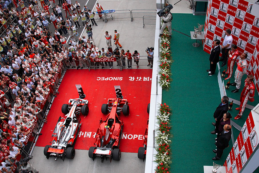 View at the parc ferme after the race with Hamilton's McLaren car and Massa's Ferrari