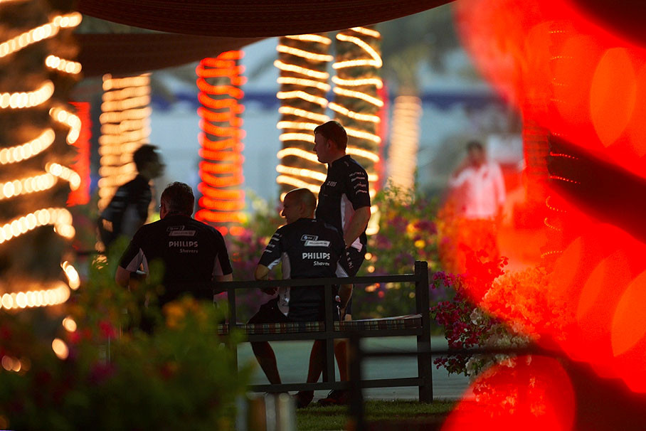 Williams mechanics between festively decorated palm trees