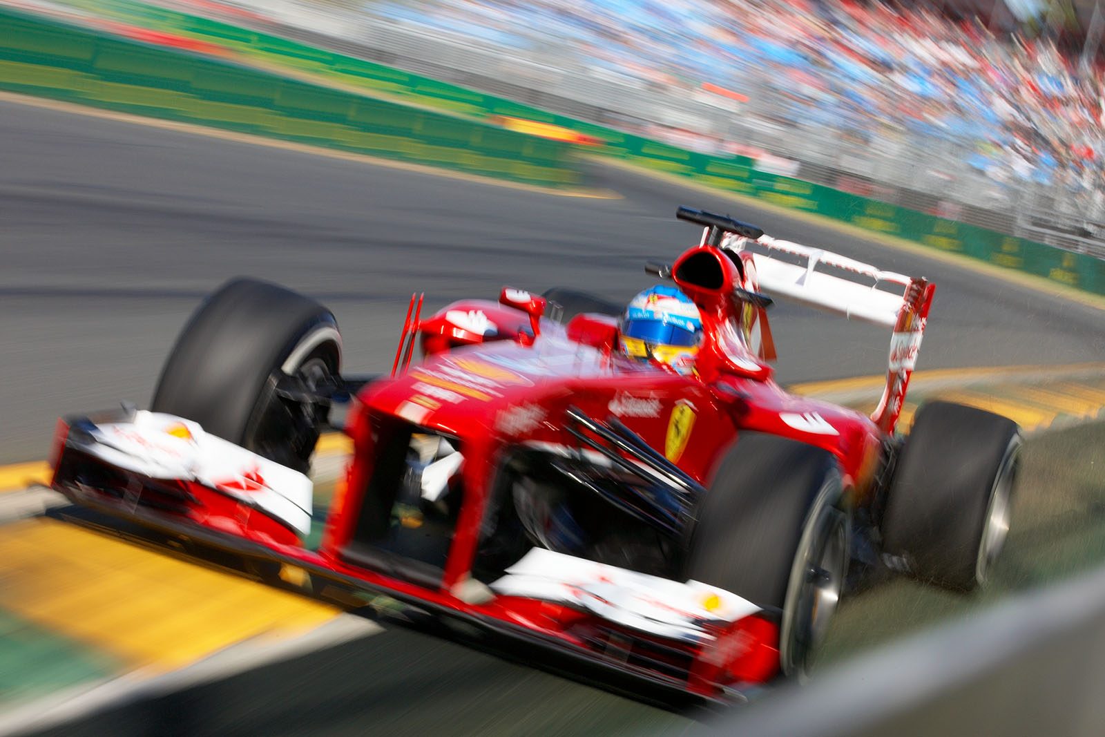 Fernando Alonso, Ferrari, far over the curb's edge