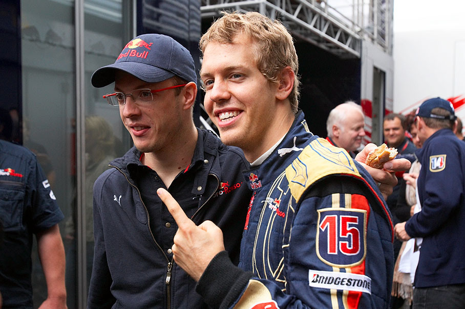 Toro Rosso team mates Vettel and Bourdais celebrate their unexpected grid positions