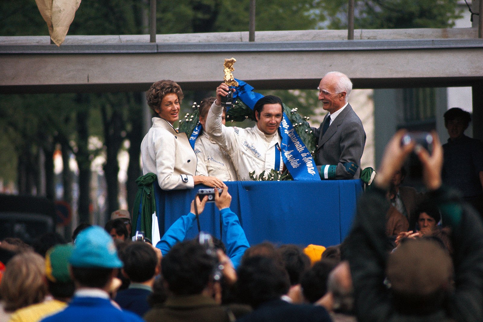Winner Pedro Rodriguez (MEX) raises his trophy
