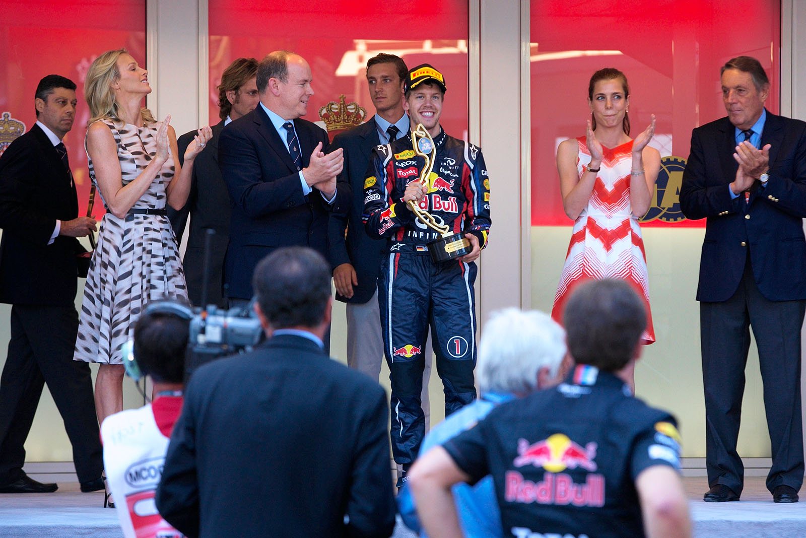 Sebastian Vettel grabs his trophy.